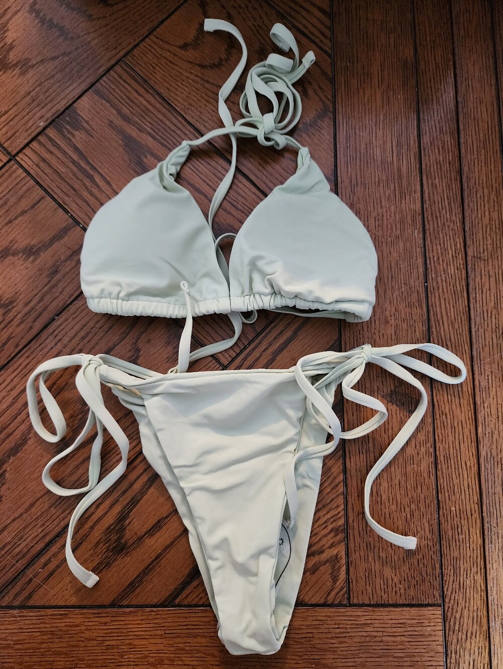 A4: Light sage green string bikini, removable pads